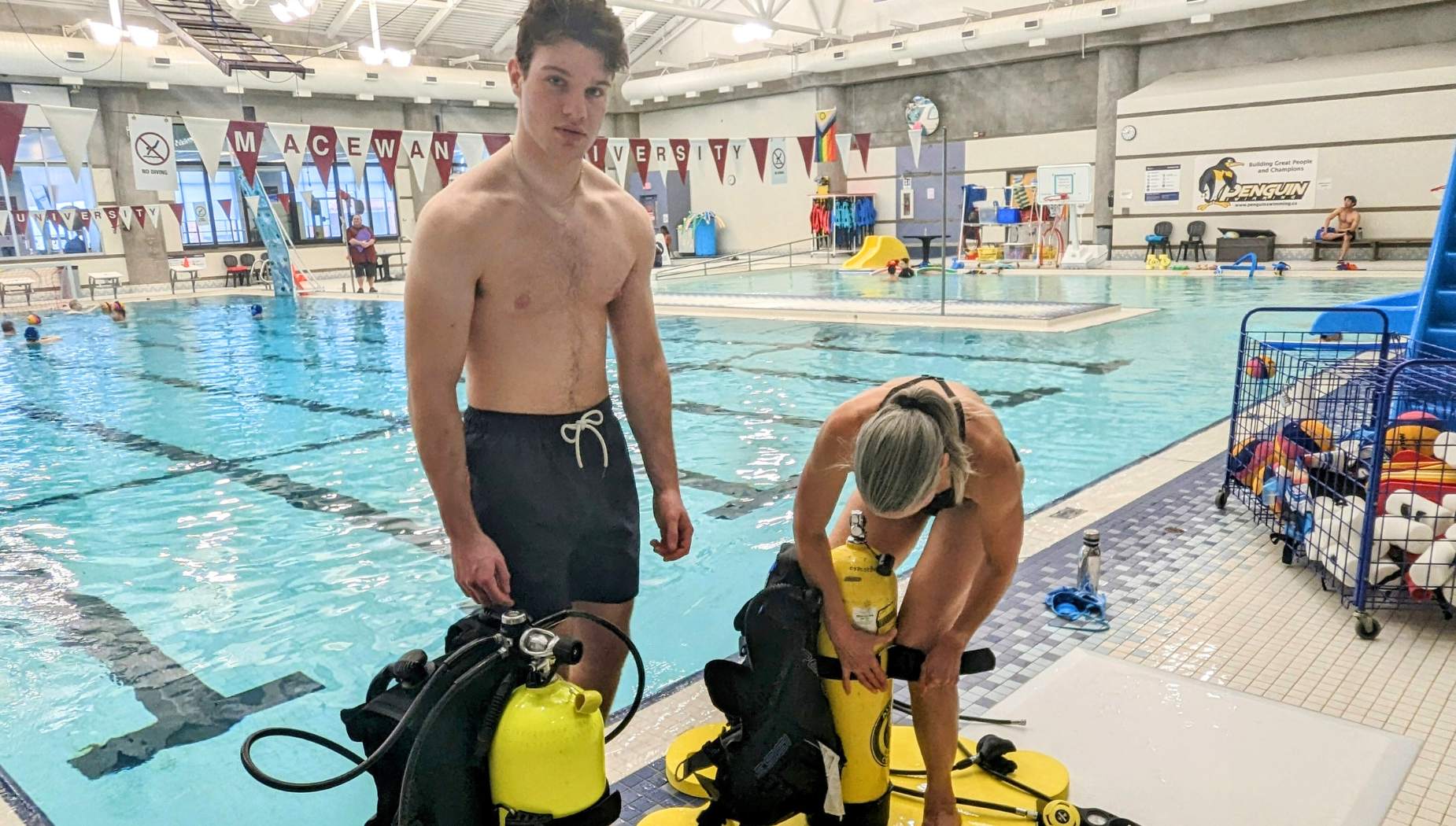 scuba divers on the pool deck